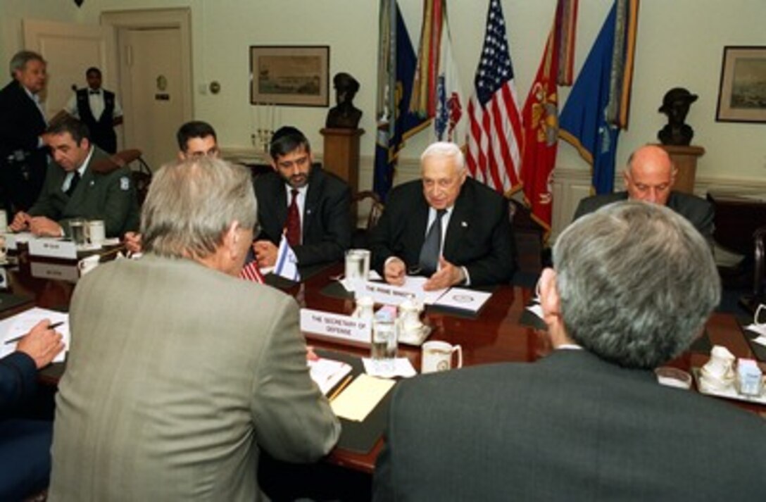 Israeli Prime Minister Ariel Sharon (center) meets with Secretary of Defense Donald H. Rumsfeld and Deputy Secretary of Defense Paul Wolfowitz in the Pentagon on May 6, 2002. Rumsfeld, Sharon and their advisors are meeting to discuss defense issues of mutual concern. 