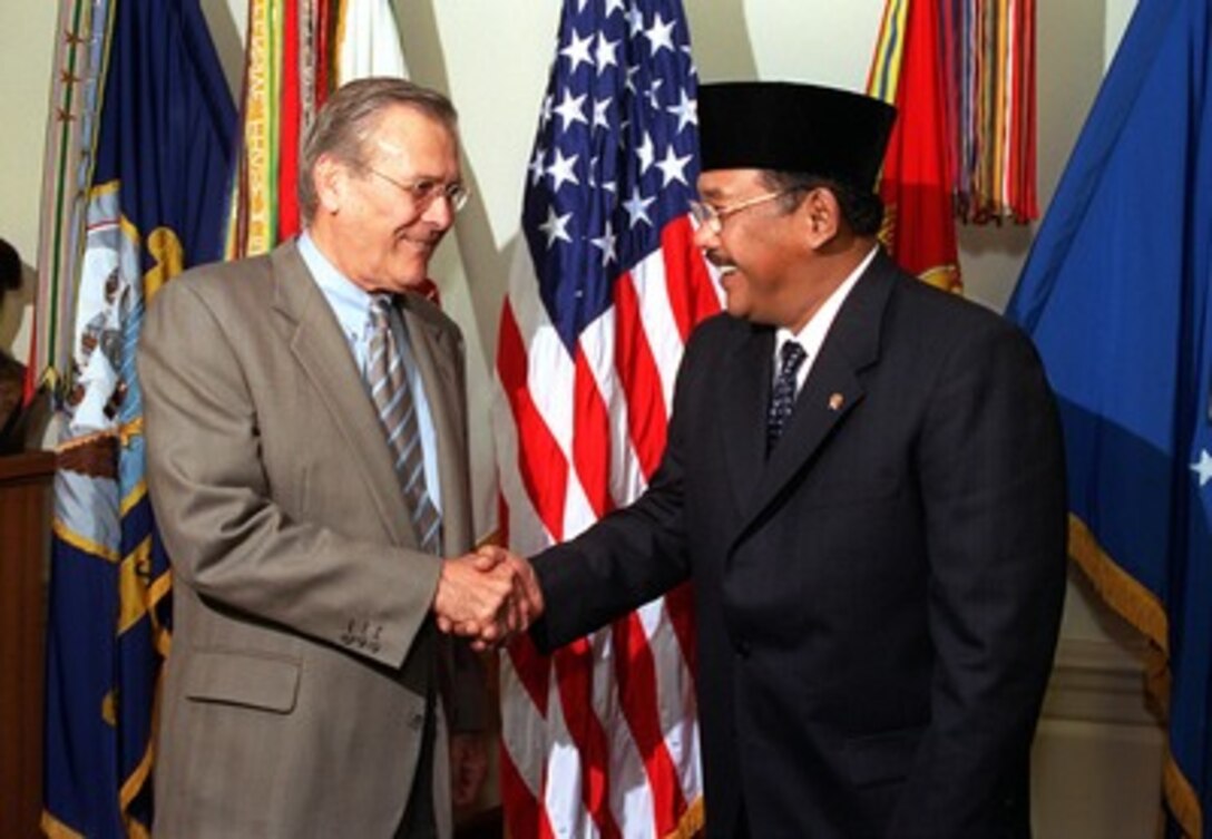 Secretary of Defense Donald H. Rumsfeld (left) welcomes Indonesian Minister of Defense Matori Abdul Djalil (right) to the Pentagon on May 13, 2002. The two defense leaders will meet to discuss a range of bilateral security issues including the war on terrorism. 
