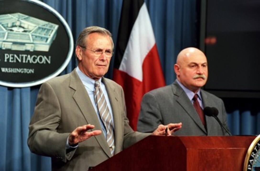 Secretary of Defense Donald H. Rumsfeld (left) responds to a reporter's question during a joint press conference with Georgian Minister of Defense David Tevzadze in the Pentagon on May 7, 2002. Rumsfeld and Tevzadze met earlier to discuss the war on terrorism and regional security issues. 