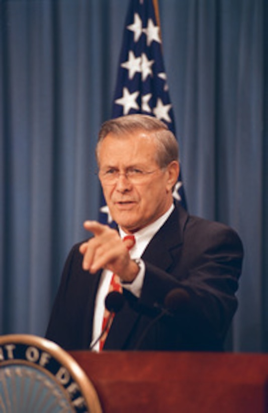 Secretary of Defense Donald H. Rumsfeld acknowledges a reporter during a Pentagon press briefing on Nov. 4, 2002. 