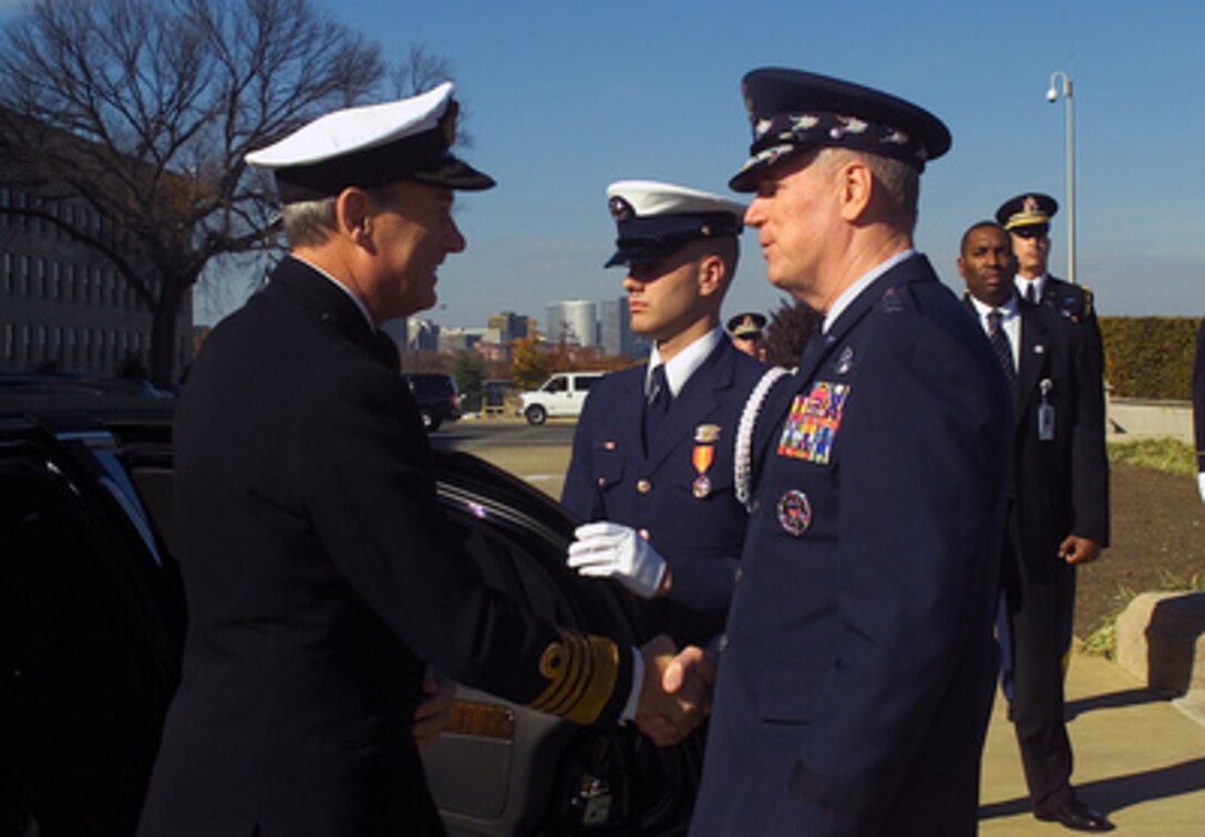 Gen. Richard B. Myers, Chairman of the Joint Chiefs of Staff, (right) greets Adm. Sir Michael Boyce, Chief of the Defence Staff, United Kingdom, (left) at the Pentagon's River entrance Nov. 14, 2002. Adm. Boyce arrived at the Pentagon for a full honor arrival ceremony as part of his counterpart visit to the United States. 