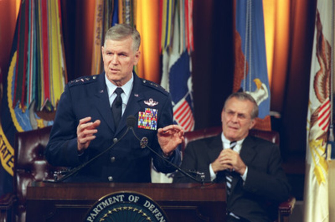 Chairman of the Joint Chiefs of Staff Gen. Richard B. Myers, U.S. Air Force, answers a question during a Pentagon Town Hall meeting on Nov. 12, 2002. Secretary of Defense Donald H. Rumsfeld (right) hosted the meeting to answer questions from military members and civilian employees of the Department of Defense. 