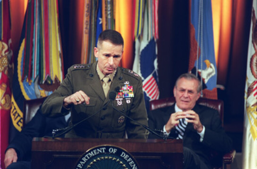 Vice Chairman of the Joint Chiefs of Staff Gen. Peter Pace, U.S. Marine Corps, responds to a question during a Pentagon Town Hall meeting on Nov. 12, 2002. Secretary of Defense Donald H. Rumsfeld (right) hosted the meeting to answer questions from military members and civilian employees of the Department of Defense. 