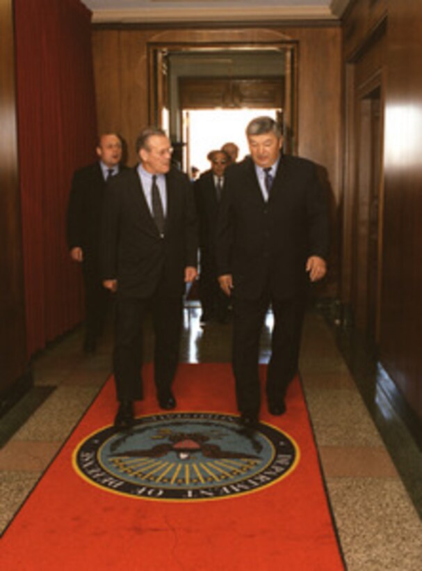 Secretary of Defense Donald H. Rumsfeld escorts Minister of Defense General-Colonel Mukhtar Alytnbaev, of the Republic of Kazakhstan, through an honor cordon and into the Pentagon on Nov. 14, 2002. The two leaders will meet to discuss defense issues of mutual interest. 