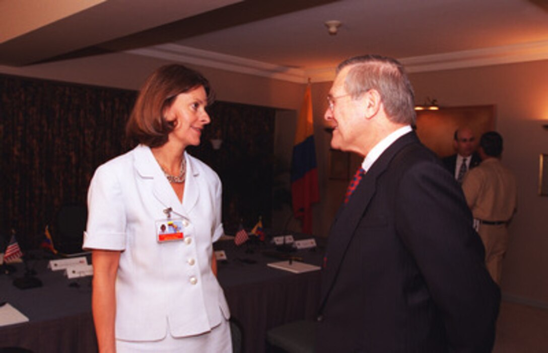 Colombian Minister of Defense Marta Lucia Ramirez (left) talks with Secretary of Defense Donald H. Rumsfeld (right) during the Defense Ministerial of the Americas in Santiago, Chile Nov. 18, 2002. 