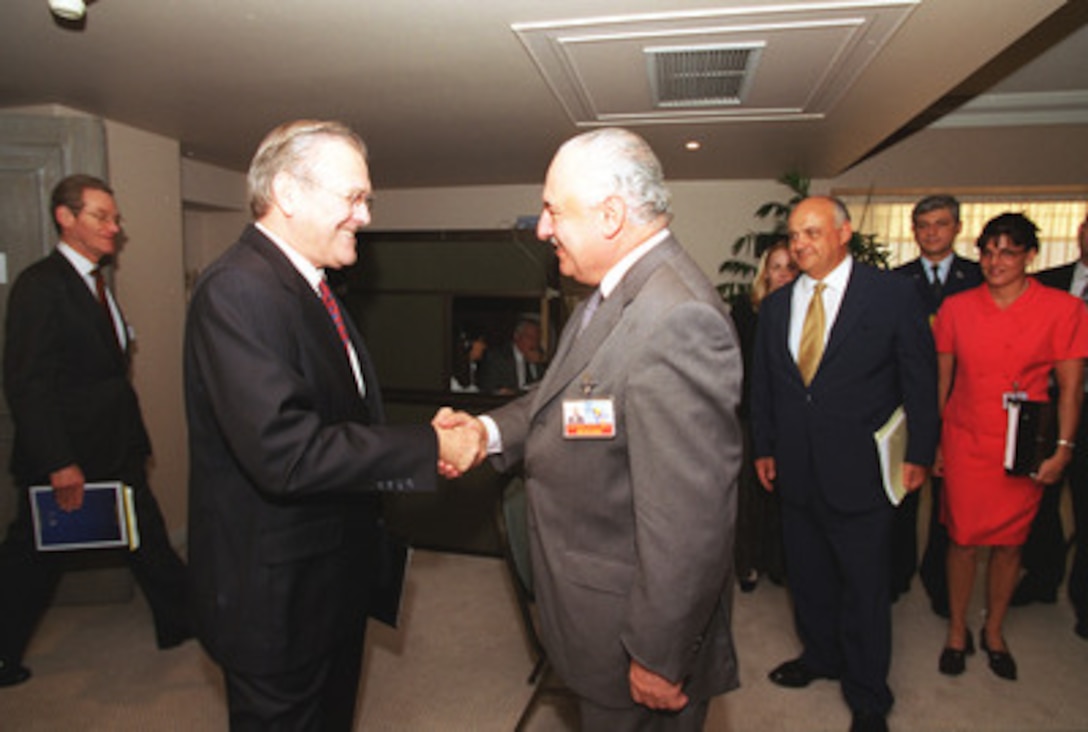 Secretary of Defense Donald H. Rumsfeld greets Argentina's Minister of Defense Jose Horacio Jaunarena as they arrive for their bilateral meeting in Santiago, Chile, on Nov.18, 2002. The defense leaders are in Santiago, Chile attending the Defense Ministerial of the Americas. 