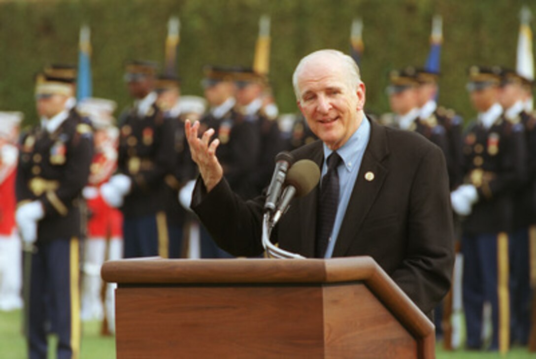 U.S. Congressman Sam Johnson, of Texas, addresses the audience at the Pentagon parade field during the observance of National POW/MIA Recognition Day on Sept. 20, 2002. Johnson, an Air Force fighter pilot during the Korean and Vietnam Wars, spent seven years in captivity in Hanoi, Vietnam, after his F-4 Phantom was shot down on his 25th combat mission of that war. Secretary of Defense Donald H. Rumsfeld and Chairman of the Joint Chiefs of Staff Gen. Richard B. Myers co-hosted the annual event. 