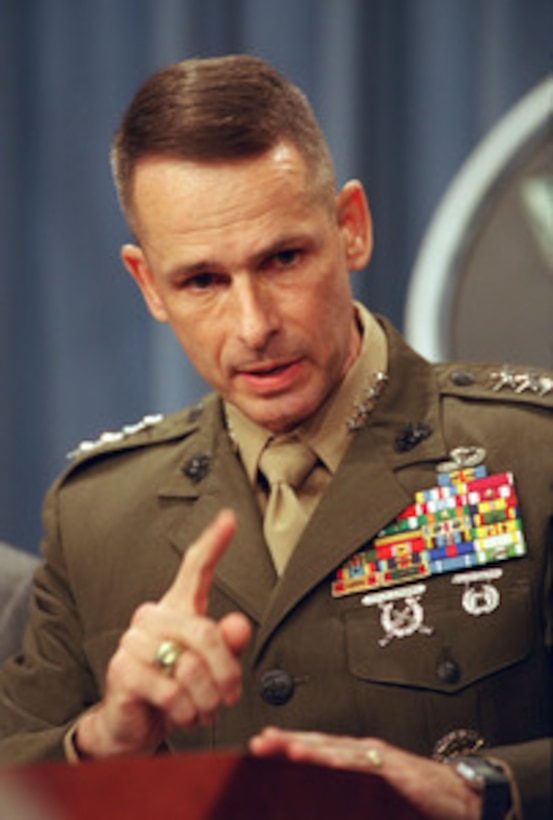Vice Chairman of the Joint Chiefs of Staff Gen. Peter Pace, U.S. Marine Corps, briefs reporters at the Pentagon on Sept. 26, 2002, concerning recent incidents of Iraqi antiaircraft units firing on coalition aircraft patrolling the no-fly zones. 
