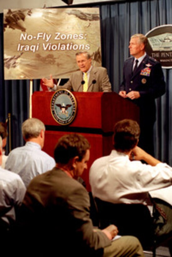 Secretary of Defense Donald H. Rumsfeld and Chairman of the Joint Chiefs of Staff Gen. Richard B. Myers, U.S. Air Force, brief reporters at the Pentagon on Sept. 30, 2002, about the continuing attempts by Iraq to shoot down coalition aircraft patrolling the no-fly zones in the north and south of the country. 