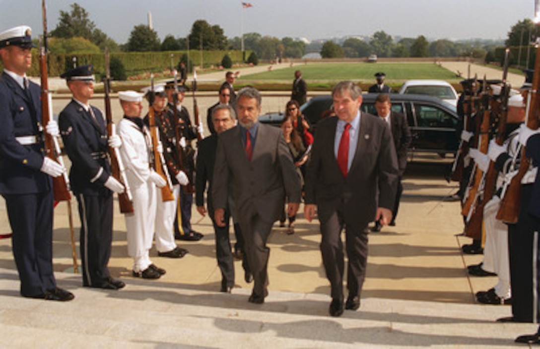 President Jose Alexander Gusmao (left), of East Timor, arrives at the Pentagon on Oct. 2, 2002, for a meeting with Deputy Secretary of Defense Paul Wolfowitz (right). The two men and their staffs will meet to discuss a range of regional security issues. 