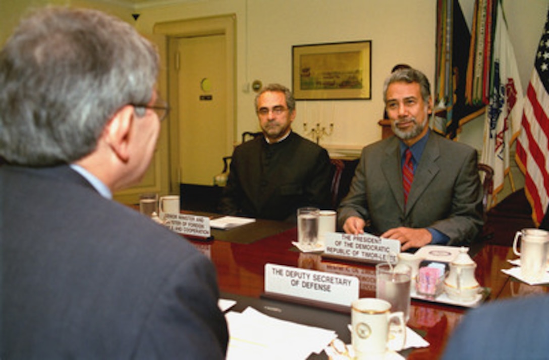 President Jose Alexander Gusmao (right), of East Timor, meets with Deputy Secretary of Defense Paul Wolfowitz (left foreground) in the Pentagon on Oct. 2, 2002. The two men and their staffs are meeting to discuss a range of regional security issues. Also participating in the talks is Senior Minister and Minister of Foreign Affairs Jose Roamos-Horta (center). 