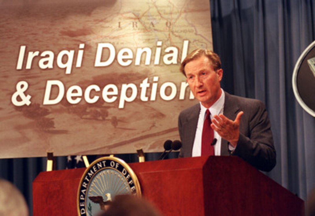 John Yurechko, of the Defense Intelligence Agency, briefs reporters at the Pentagon on Oct. 8, 2002, concerning the ways in which the Iraqi regime of Saddam Hussein seeks to hide its illegal weapons programs from the rest of the world. 