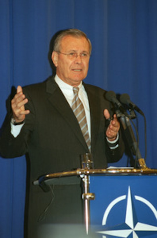 Secretary of Defense Donald H. Rumsfeld holds a press conference in Warsaw, Poland, on Sept. 25, 2002, at the close of the two-day informal meeting of NATO defense ministers. Rumsfeld pointed out that the meeting itself was historic in that it occurred on the soil of a former Soviet ally--a first for NATO. Each Autumn the defense ministers gather at a select location within the borders of one of the member-nations, instead of their usual venue at NATO Headquarters in Brussels, Belgium, for the informal non-binding meetings. This year Poland became the first nation of NATO's former adversary--the Warsaw Pact--to host such an event. 