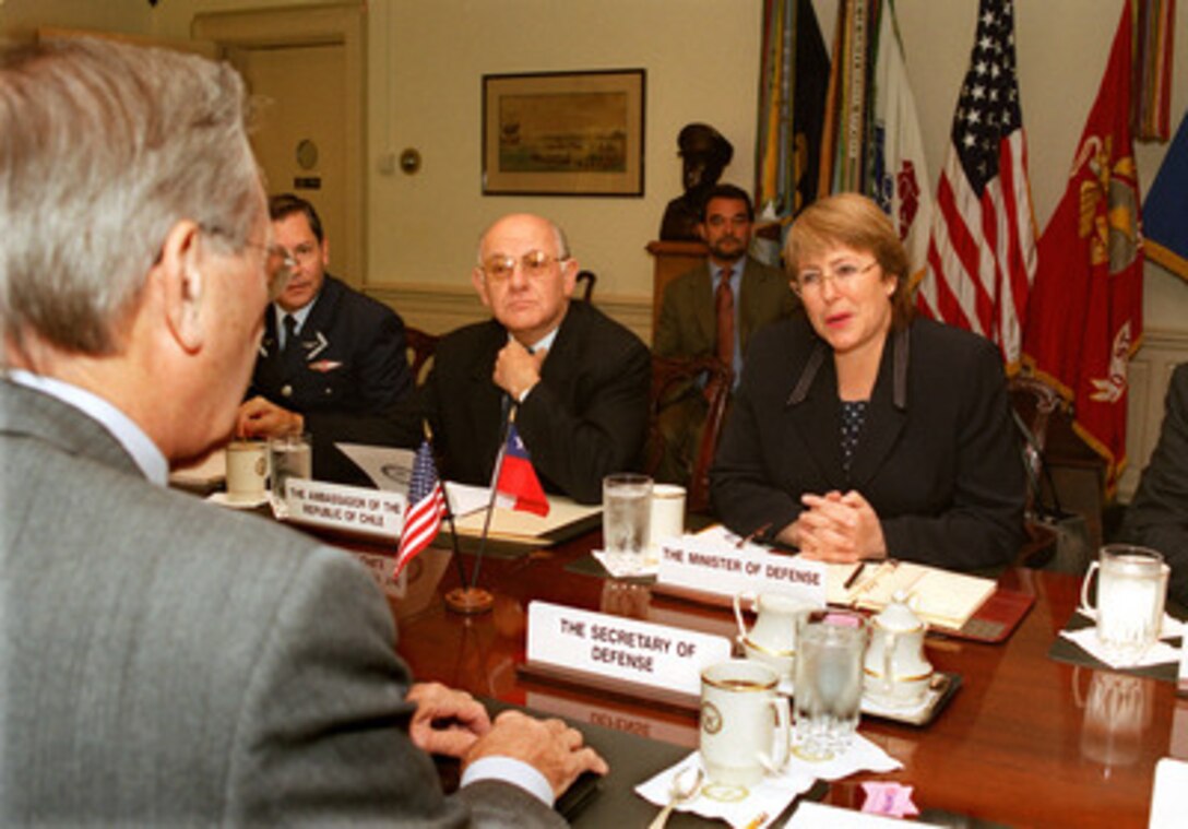 Chilean Minister of Defense Michelle Bachelet (right) meets with Secretary of Defense Donald H. Rumsfeld (foreground) in the Pentagon on Oct. 8, 2002. Bachelet and Rumsfeld are meeting to discuss a broad range of regional and global security issues. Also participating in the talks is Chile's Ambassador to the U.S. Andres Bianchi (center) and Maj. Gen. Osvaldo Sarabia (left, background), chairman of the Chilean Joint Chiefs of Staff. 