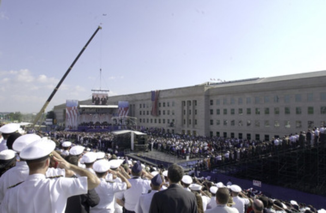 Marine Corps Staff Sgt. Kevin Bennear sings "The National Anthem," while accompanied by The U.S. Marine Corps Band during the Sept. 11 Memorial Service at the Pentagon. More than 13,000 people attended the service to remember those who lost their lives one year ago when terrorists crashed a commercial airliner into the building. (