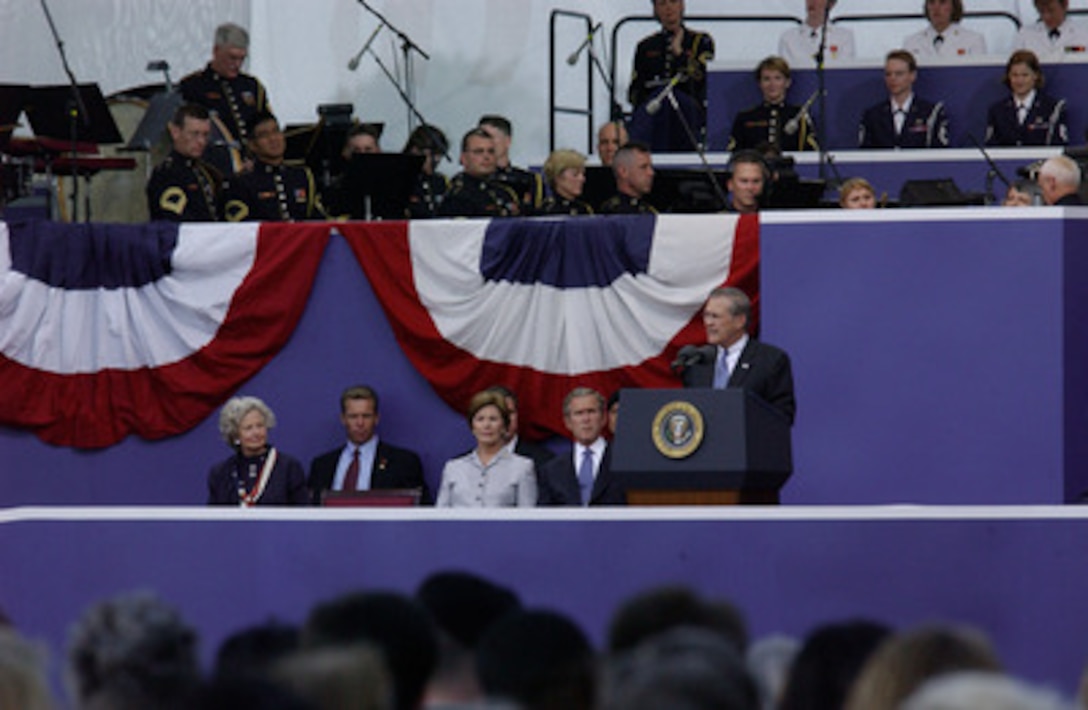 Secretary of Defense Donald H. Rumsfeld speaks during the Sept. 11 Memorial Service at the Pentagon. More than 13,000 people attended the service to remember those who lost their lives one year ago when terrorists crashed a commercial airliner into the Pentagon. 