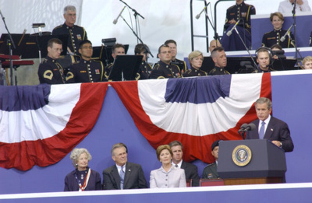 President George W. Bush speaks during the Sept. 11 Memorial Service at the Pentagon. More than 13,000 people attended the service to remember those who lost their lives one year ago when terrorists crashed a commercial airliner into the Department of Defense Headquarters. 