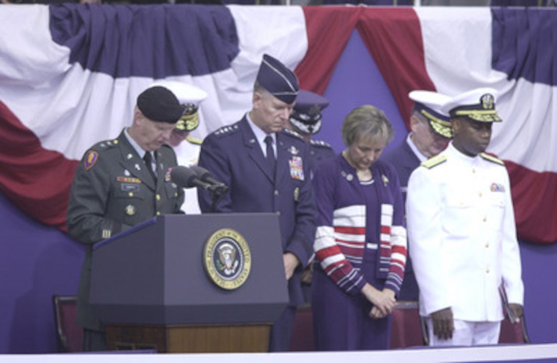 Major Gen. Gaylord Gunhus, U.S. Army Chief of Chaplains, gives the invocation at the Sept. 11 Observance Ceremony at the Pentagon. More than 13,000 people attended the service to remember those who lost their lives one year ago when terrorists crashed a commercial airliner into the Pentagon. 