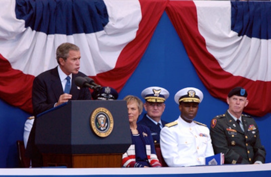 President George W. Bush speaks during the Sept. 11 Observance Ceremony at the Pentagon. More than 13,000 people attended the service to remember those who lost their lives one year ago when terrorists crashed a commercial airliner into the Pentagon. 