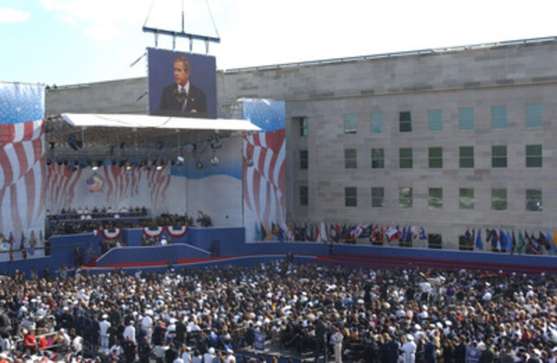 President George W. Bush speaks during the Sept. 11 Observance Ceremony at the Pentagon. More than 13,000 people attended the service to remember those who lost their lives one year ago when terrorists crashed a commercial airliner into the Pentagon. 