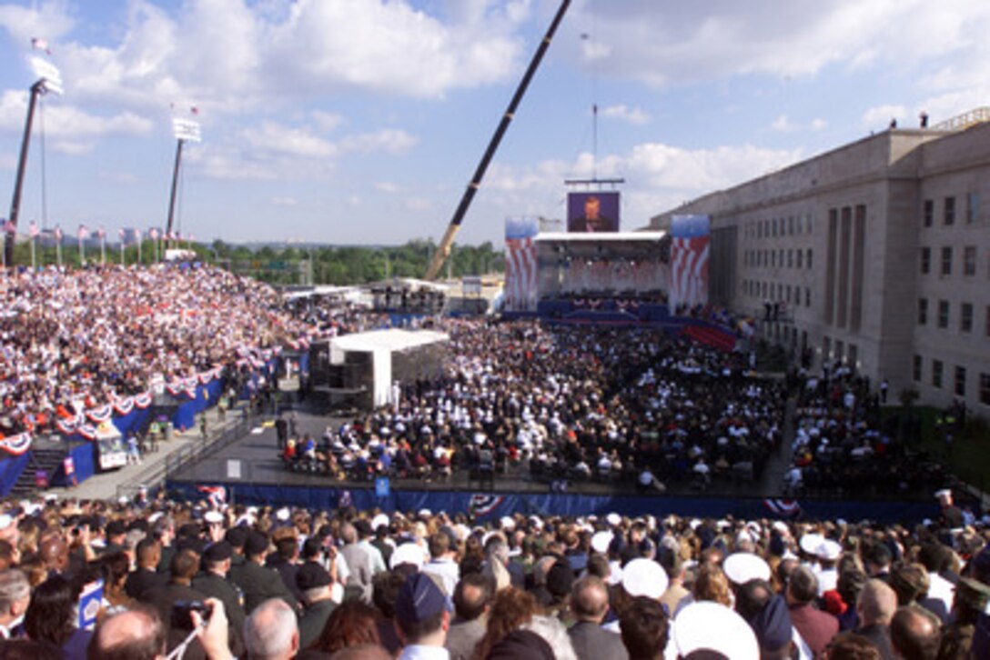 Secretary of Defense Donald H. Rumsfeld speaks during the Sept. 11 Observance Ceremony at the Pentagon. More than 13,000 people attended the service to remember those who lost their lives one year ago when terrorists crashed a commercial airliner into the Pentagon. 