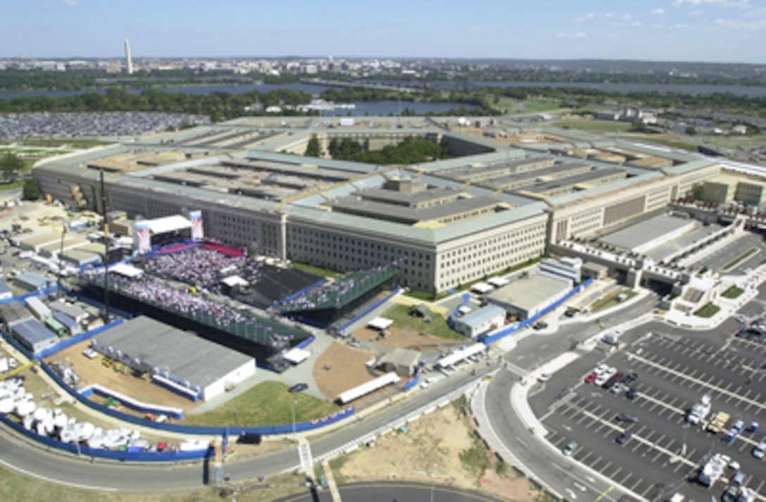 A temporary stage, bleachers and seating for the Pentagon Observance ceremony occupy the area of the Pentagon known as the Phoenix Site on Sept. 11, 2002. More than 13,000 people attended the service to remember those who lost their lives one year ago when terrorists crashed a commercial airliner into the Pentagon. Contractors, construction personnel and their families were honored in a second ceremony later in the day. 