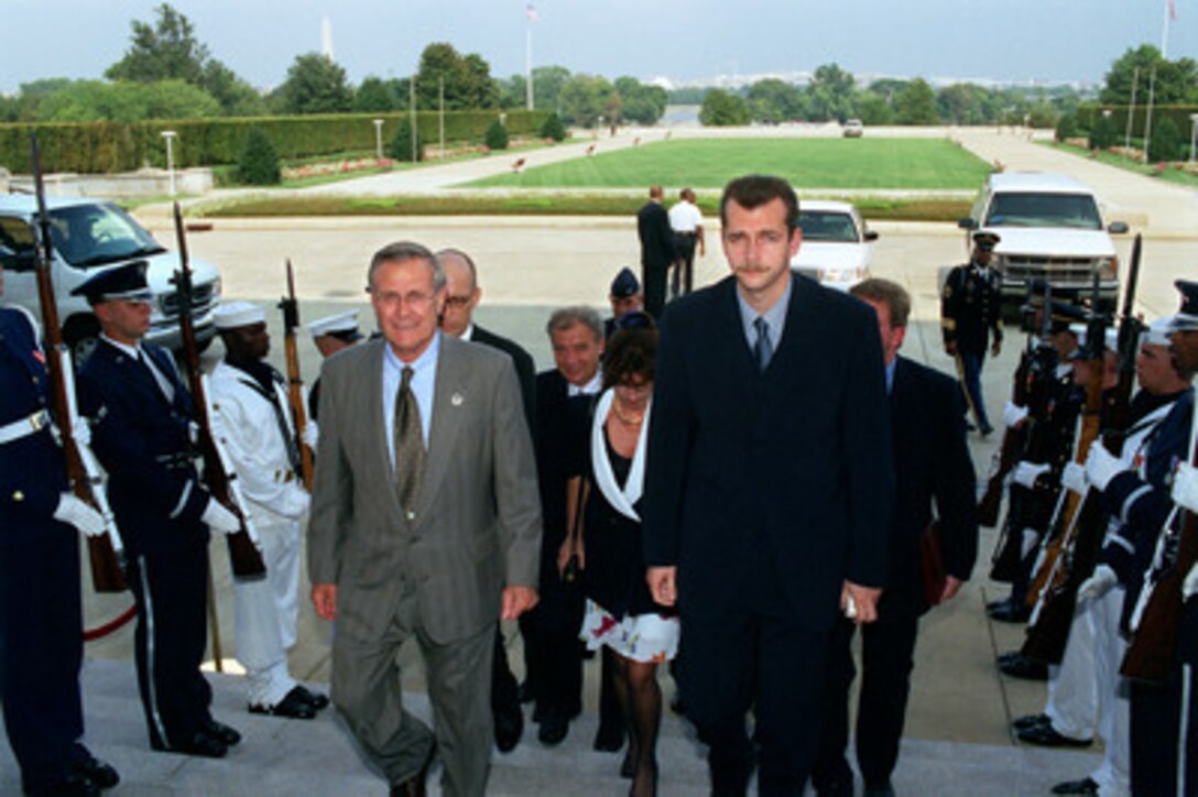 Secretary of Defense Donald H. Rumsfeld (left) escorts Czech Minister of Defense Jaroslav Tvrdik (right) into the Pentagon on Sept. 16, 2002. The two defense leaders will meet to discuss a broad range of bilateral and global security issues. 