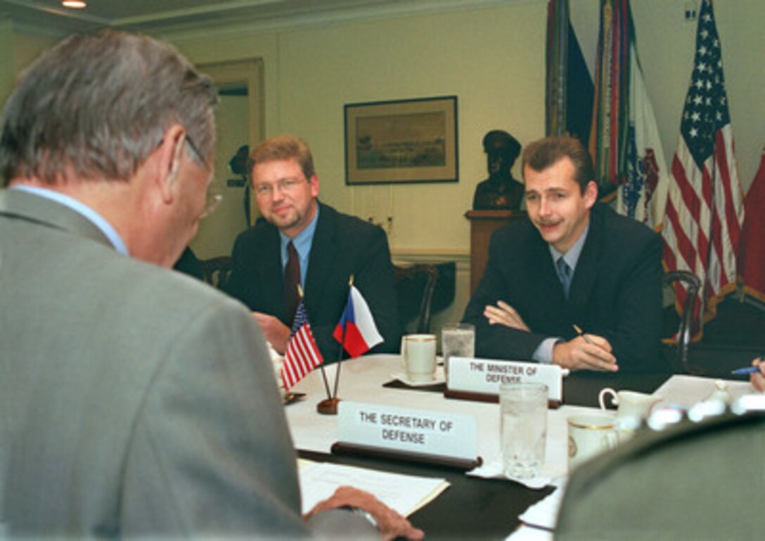 Czech Minister of Defense Jaroslav Tvrdik (right) meets with Secretary of Defense Donald H. Rumsfeld to discuss a range of bilateral and global security issues in the Pentagon on Sept. 16, 2002. Also participating in the talks is Czech Ambassador to the United States Martin Palous (center). 