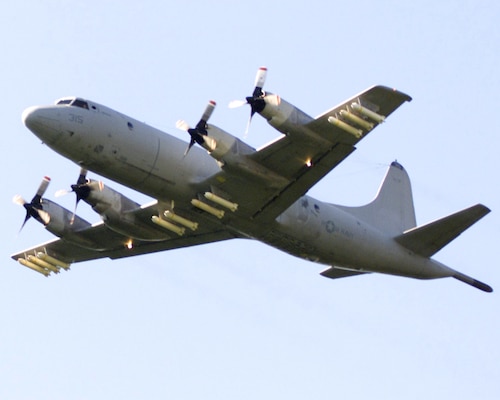 Brunswick, Me. (Sep. 19, 2002) -- A P-3C Orion attached to the Tigers of Patrol Squadron Eight (VP-8) heads to a bombing exercise loaded with MK-20 Rockeye cluster bombs. MK-20 cluster bombs deliver 247 bomblets, which, upon detonation, release a jet of super heated and pressurized gas, which can penetrate 10 inches of steel and 31 inches of reinforced concrete. The weapon's dispersion area is roughly the size of a football field.