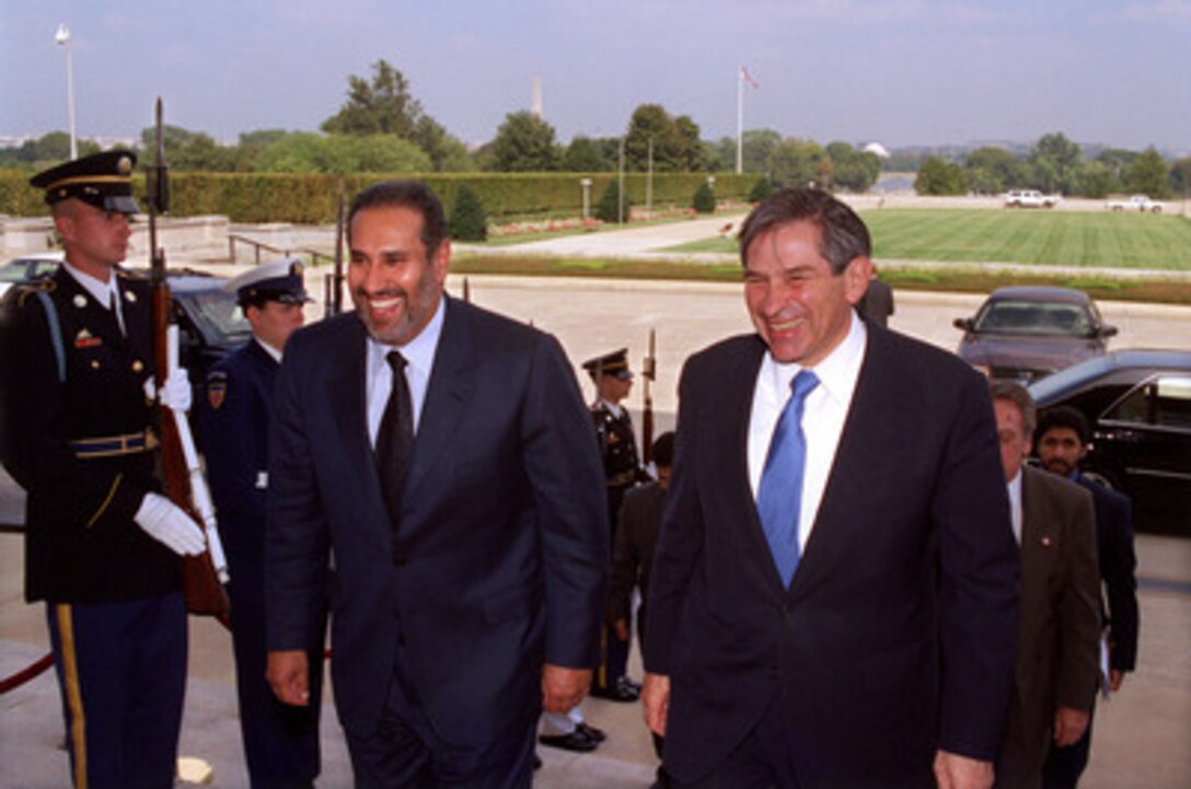Deputy Secretary of Defense Paul Wolfowitz (right) escorts Minister of Foreign Affairs Shaikh Hamad bin Jasim bin Jabir Al Thani, of Qatar, through an honor cordon and into the Pentagon on Sept. 17, 2002. The two men will meet to discuss a number of regional security issues. 