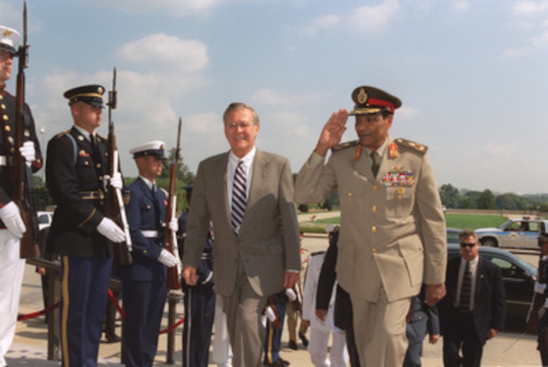 Secretary of Defense Donald H. Rumsfeld escorts Field Marshal Mohamed Hussein Tantawi, minister of defense of Egypt, into the Pentagon on Sept. 17, 2002. The two defense leaders will meet to discuss defense issues of mutual interest. 