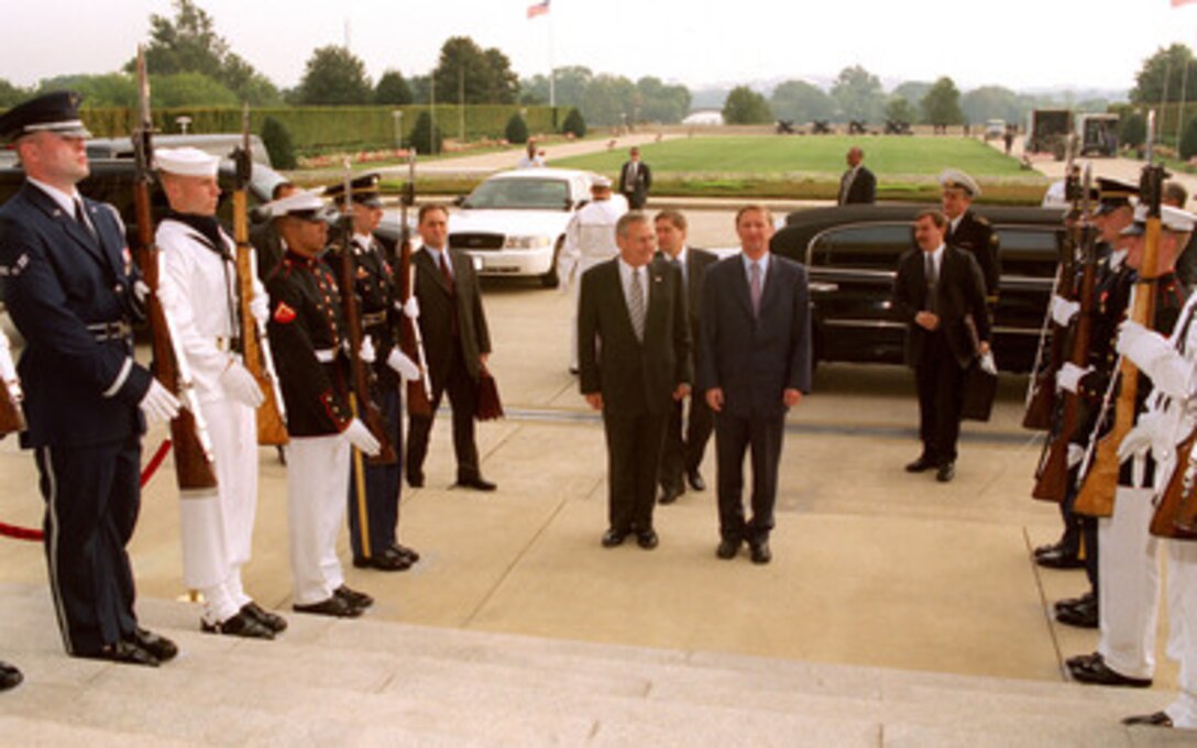 Russian Defense Minister Sergey Ivanov (right) arrives at the Pentagon on Sept. 19, 2002, to meet with Secretary of Defense Donald H. Rumsfeld (left). The two defense leaders will discuss a range of bilateral security issues. 