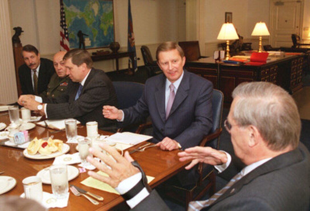 Russian Defense Minister Sergey Ivanov (2nd from right) meets with Secretary of Defense Donald H. Rumsfeld (right) in the Pentagon on Sept. 19, 2002, to discuss a number of bilateral security issues. Accompanying Ivanov are (left to right): Gen-Maj. Andrey Chobotov, assistant to the Minister of Defense; Gen-Col. Yuriy Baluyevskjy, first deputy chief of the General Staff of the Armed Forces of the Russian Federation, and Russia's Ambassador to the U.S. Yuriy Ushakov. 
