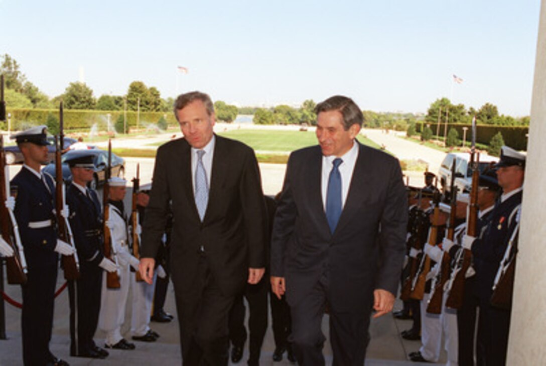 Jaap de Hoop Scheffer, Minister of Foreign Affairs of the Netherlands is escorted through an honor cordon and into the Pentagon by Deputy Secretary of Defense Paul D. Wolfowitz on Sept. 24, 2002. The leaders are meeting to discuss defense issues of mutual interest. 