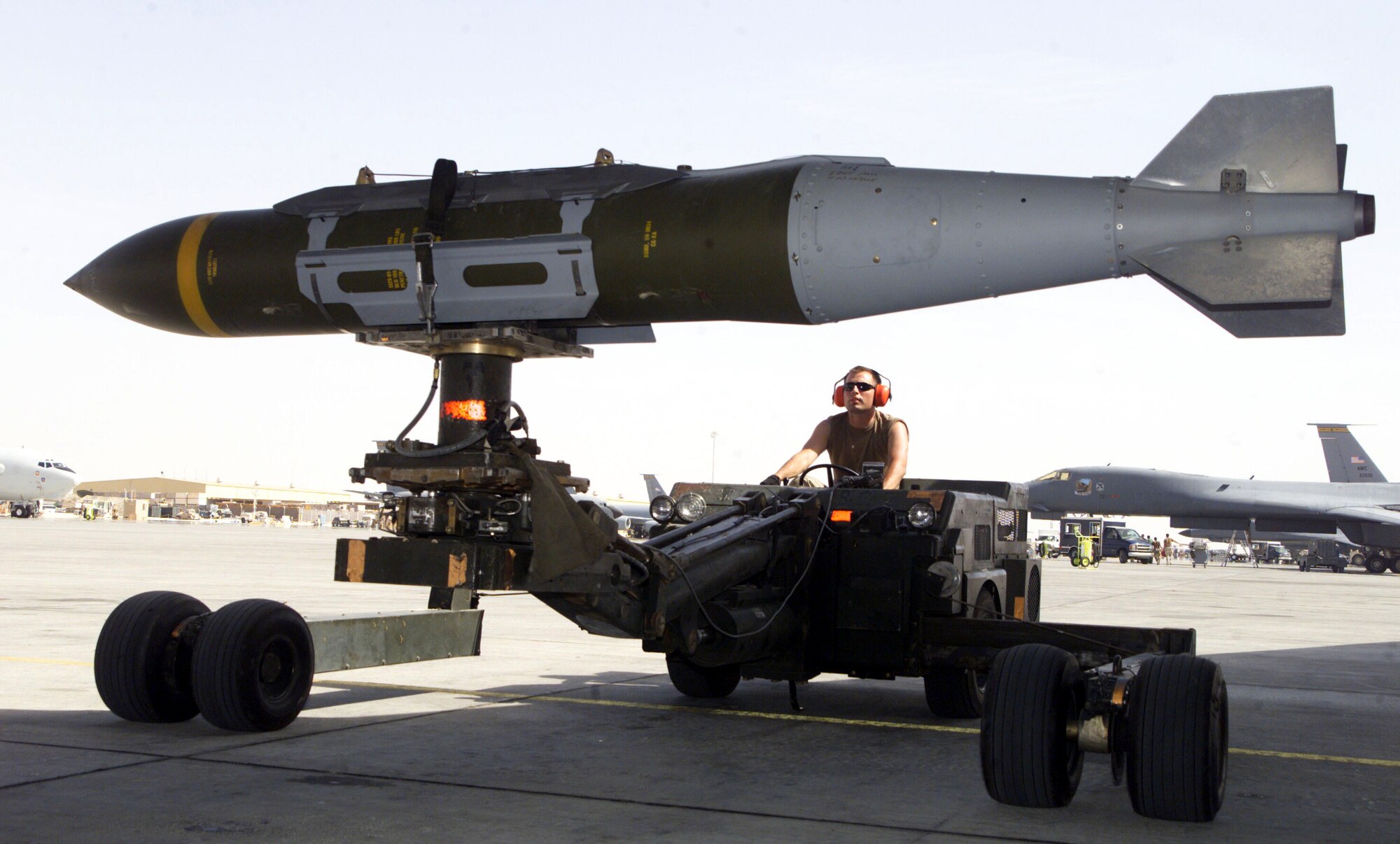OPERATION IRAQI FREEDOM -- A weapons loader prepares a GBU-31 joint direct attack munition for a mission at a forward-deployed location.  Smart bombs like the JDAM have comprised 80 percent of the munitions used during this operation.  (U.S. Air Force photo by Staff Sgt. Jessica Kochman)