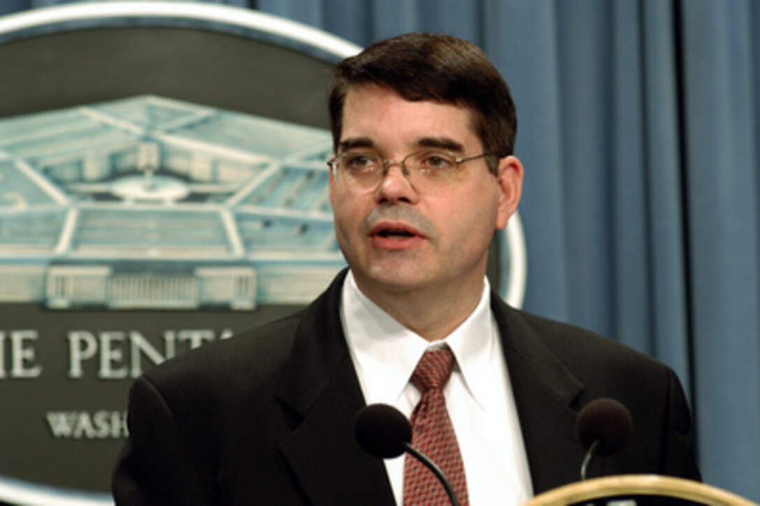 Deputy Assistant Secretary of Defense for Public Affairs (Media Operations) Bryan G. Whitman introduces Ambassador Pierre-Richard Prosper, U.S. ambassador for war crimes issues and Special Assistant to the Judge Advocate General of the Army W. Hays Parks to reporters during a Pentagon press briefing on April 7, 2003. Prosper and Parks discussed aspects of the Geneva Convention, the laws of war, the handling of prisoners of war, and war crimes. 