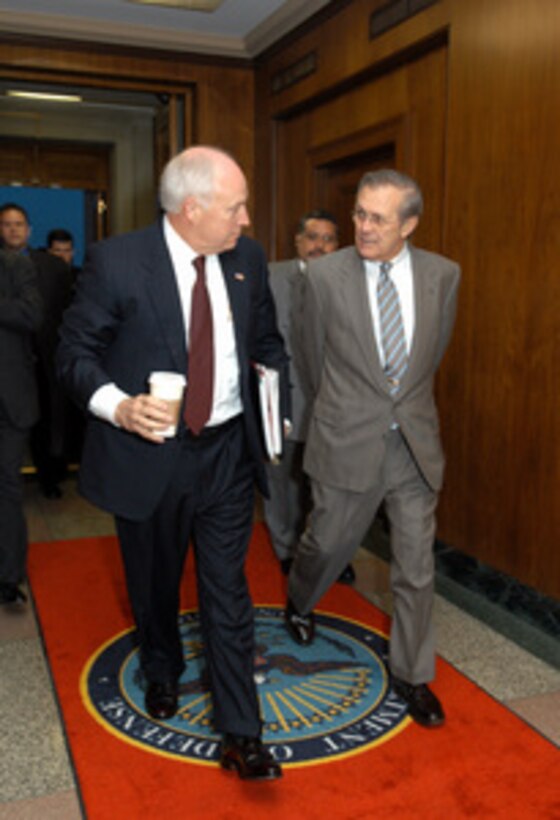 Secretary of Defense Donald H. Rumsfeld escorts Vice President Dick Cheney into the Pentagon on April 8, 2003. Cheney will attend an operational update briefing on the progress of Operation Iraqi Freedom with Rumsfeld, representatives of the Joint Chiefs of Staff and other senior Department of Defense officials. Operation Iraqi Freedom is the multinational coalition effort to liberate the Iraqi people, eliminate Iraq's weapons of mass destruction and end the regime of Saddam Hussein. 
