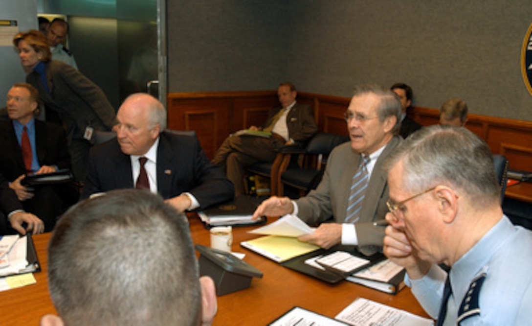 Secretary of Defense Donald H. Rumsfeld (center) chairs an operational update on the progress of Operation Iraqi Freedom at the Pentagon on April 8, 2003. Vice President Dick Cheney (left) and Chairman of the Joint Chiefs of Staff Gen. Richard B. Myers (right), U.S. Air Force, joined Rumsfeld for the secure video teleconference with field commanders. Operation Iraqi Freedom is the multinational coalition effort to liberate the Iraqi people, eliminate Iraq's weapons of mass destruction and end the regime of Saddam Hussein. 