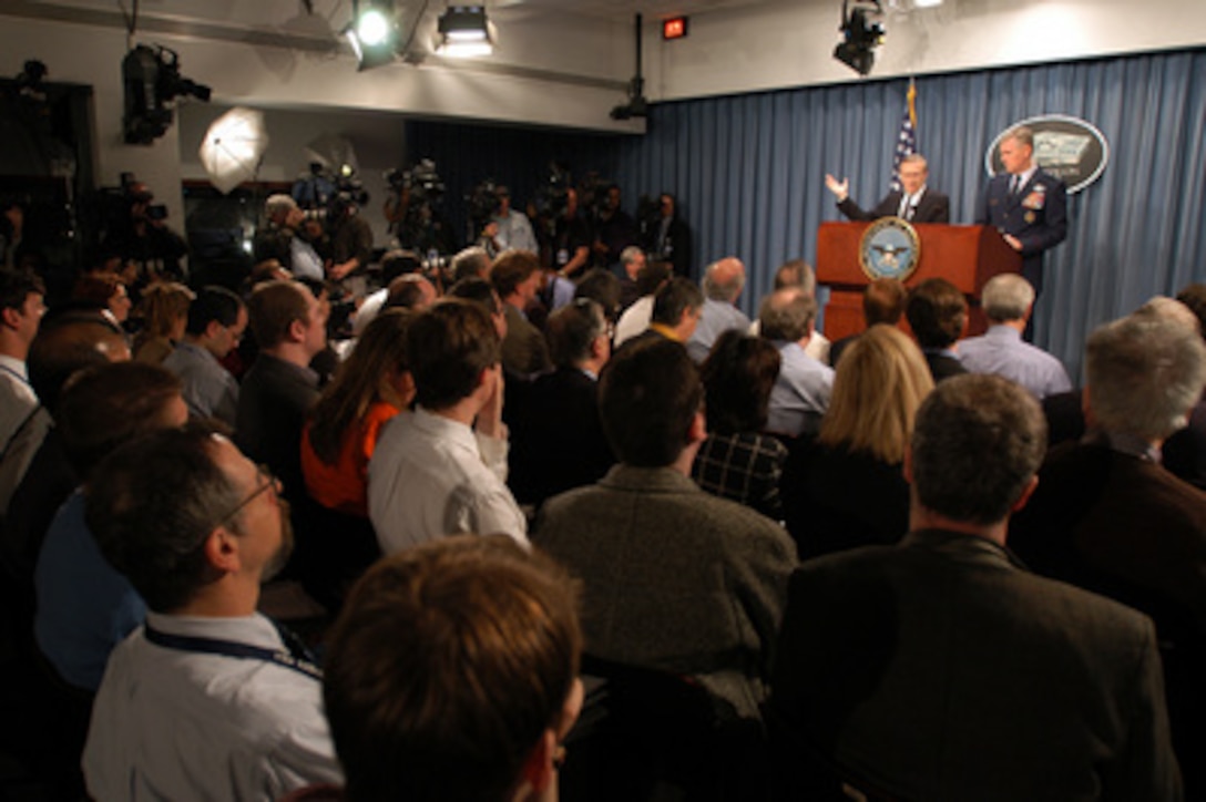 Secretary of Defense Donald H. Rumsfeld cautions a room full of reporters that the conflict in Iraq is far from over during a Pentagon press conference on April 9, 2003. Rumsfeld and Chairman of the Joint Chiefs of Staff Gen. Richard B. Myers, U.S. Air Force, briefed reporters on the progress of Operation Iraqi Freedom, which is the multinational coalition effort to liberate the Iraqi people, eliminate Iraq's weapons of mass destruction and end the regime of Saddam Hussein. 