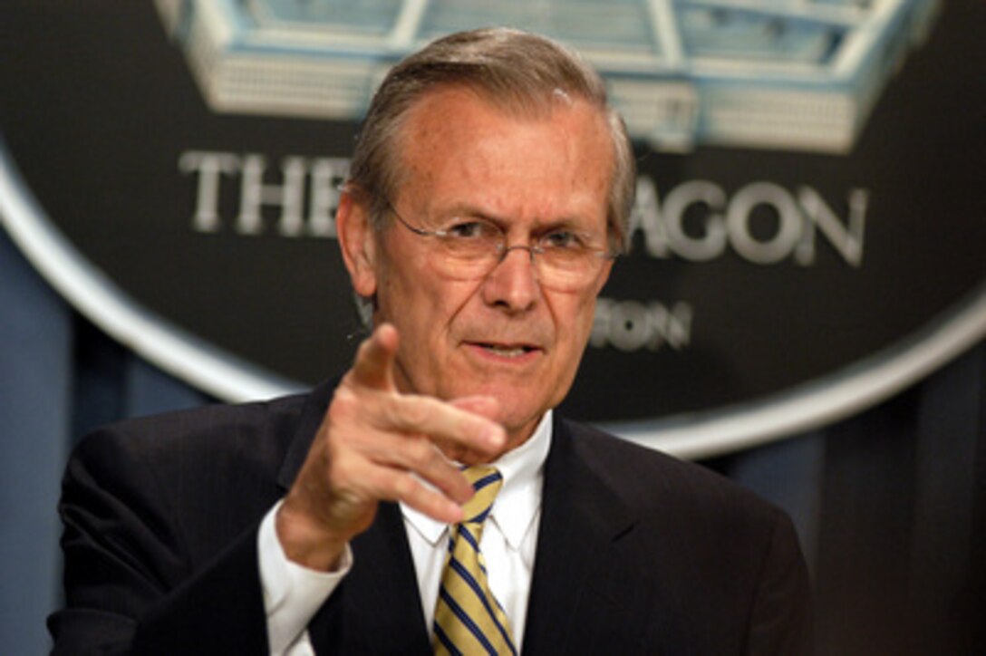 Secretary of Defense Donald H. Rumsfeld gestures as he answers a reporter's question during a Pentagon press briefing with Chairman of the Joint Chiefs of Staff Gen. Richard B. Myers, U.S. Air Force, on April 15, 2003. Rumsfeld and Myers gave the reporters an update on the situation in Iraq. 