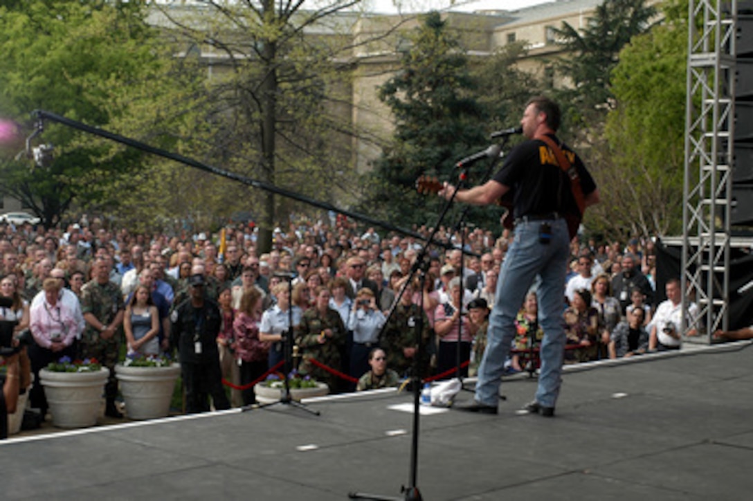 Nashville singer/songwriter Darryl Worley sings during a concert in the center courtyard of the Pentagon on April 16, 2003. One of the songs Worley sang for the military and DoD employee audience at the Pentagon and around the world on American Forces Radio and Television was his hit single "Have You Forgotten." Worley wrote the song after traveling with the United Service Organizations to entertain troops in Afghanistan last December. 