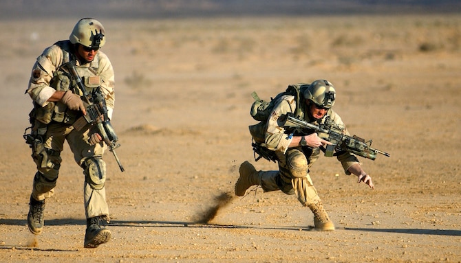 OPERATION ENDURING FREEDOM -- Combat controllers practice firing movements on the range at a forward-deployed location supporting Operation Enduring Freedom.  Air Force combat controller teams are trained to conduct and support special operations under clandestine, covert or low-visibility conditions.  (U.S Air Force photo by Staff Sgt. Jeremy T. Lock)