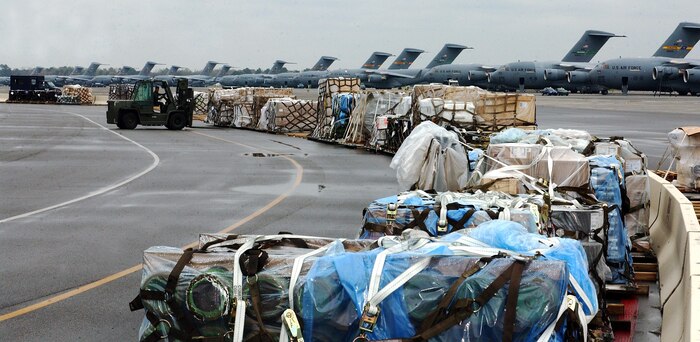 OPERATION ENDURING FREEDOM -- Numerous cargo pallets wait on the flightline of the 437th Aerial Port Squadron at Charleston Air Force Base, South Carolina, for air transport on military and commercial cargo planes supporting Operation Enduring Freedom March 18.  (U.S. Air Force photo by Staff Sergeant Jennie Ivey)  