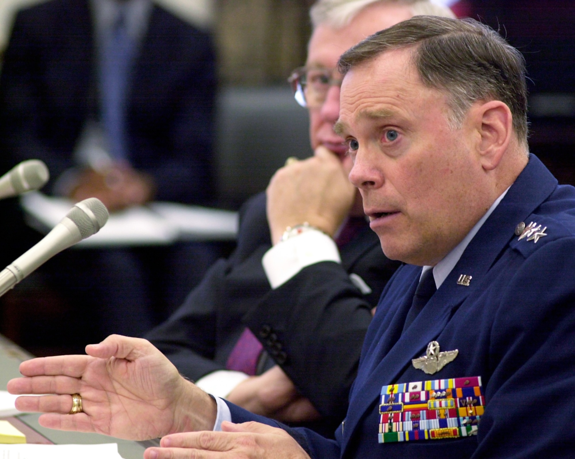 WASHINGTON -- Secretary of the Air Force Dr. James G. Roche looks on as Air Force Chief of Staff Gen. John P. Jumper answers questions during a hearing of the House Appropriations Committee subcommittee on defense on March 19.  (U.S. Air Force photo by Tech. Sgt.  Jim Varhegyi)