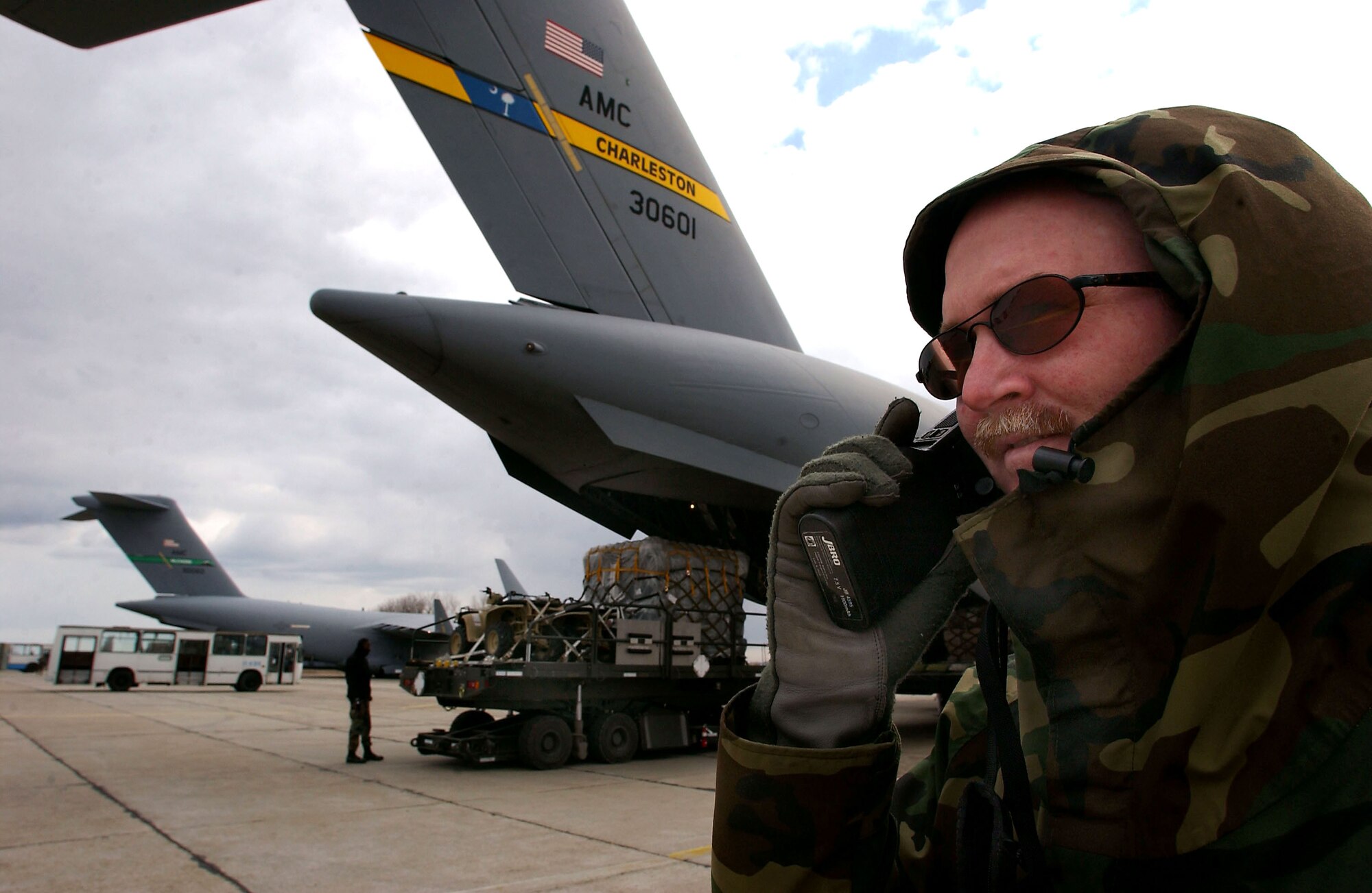 CONSTANTA, Romania -- Lt. Col Greg Staten, commander of the 349th Tanker Airlift Control Element, oversees the unloading of C-17 Globemaster IIIs from Charleston Air Force Base, S.C., and McChord AFB, Wash., on March 19. Operating 24 hours a day, the TALCE is key to maintaining troop and equipment movement for the Operation Iraqi Freedom air bridge. (U.S. Air Force photo by Master Sgt. Keith Reed)                        