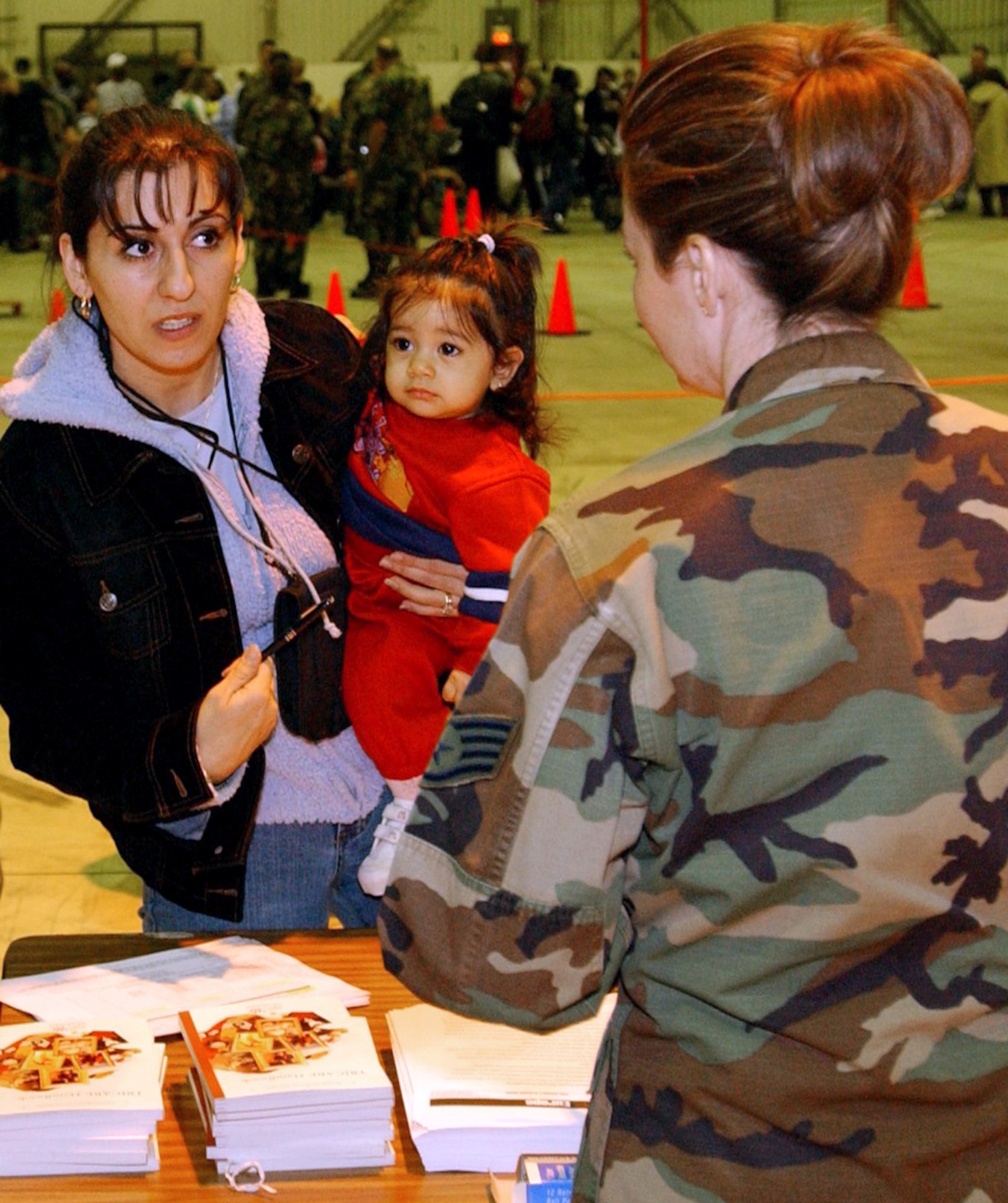 INCIRLIK AIR BASE, Turkey -- Family members of 39th Wing airmen go through a processing line March 19 as part of Incirlik's voluntary dependent relocation.  Representatives from various base agencies helped approximately 320 dependents leave the base.  The first aircraft left Incirlik at 4:30 p.m. March 20. (U.S. Air Force photo by Airman 1st Class Joseph Thompson)