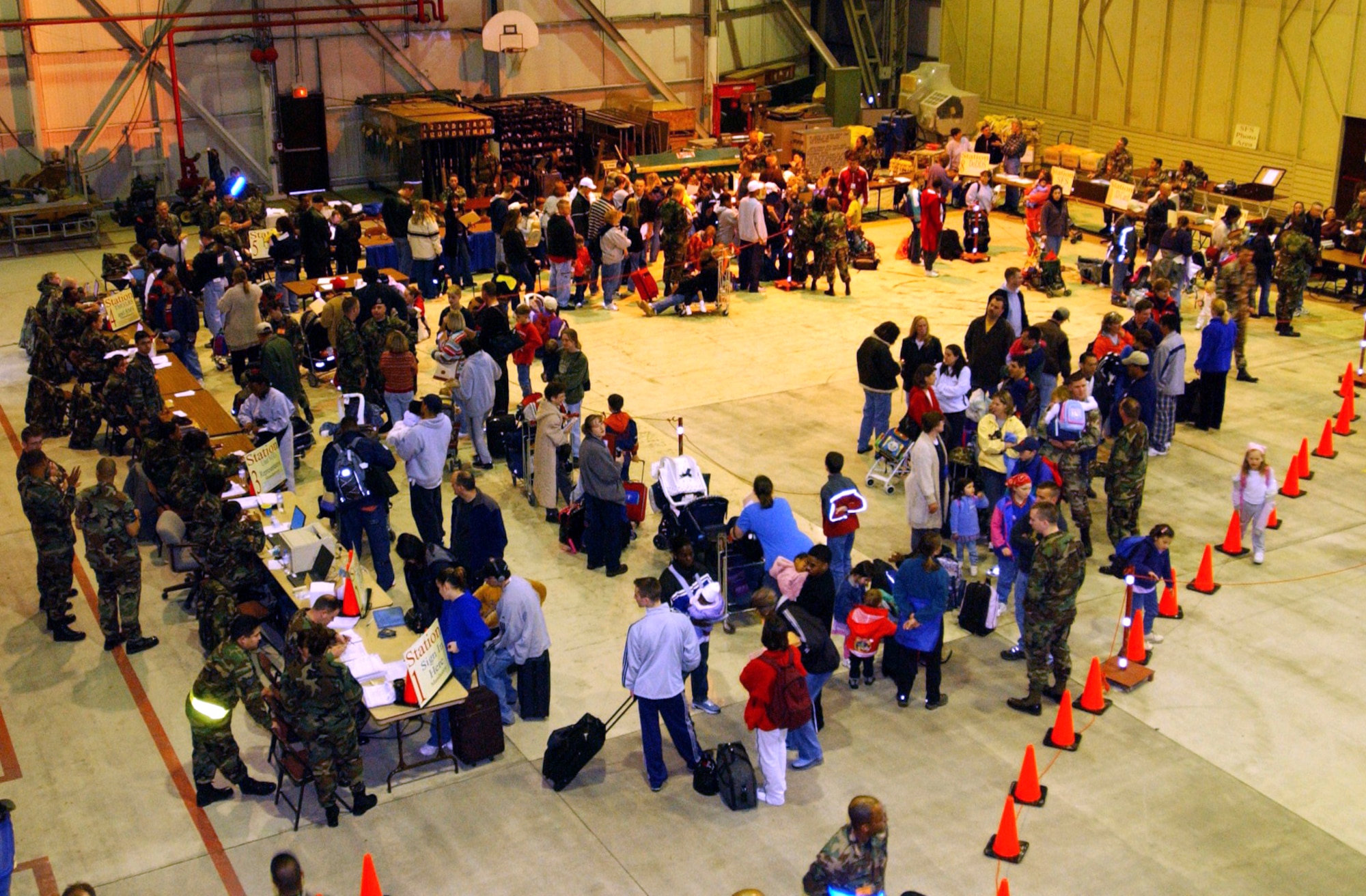 INCIRLIK AIR BASE, Turkey -- Family members of 39th Wing airmen go through a processing line March 19 as part of Incirlik's voluntary dependent relocation.  Representatives from various base agencies helped approximately 320 dependents leave the base.  The first aircraft left Incirlik at 4:30 p.m. March 20. (U.S. Air Force photo by Airman 1st Class Joseph Thompson)