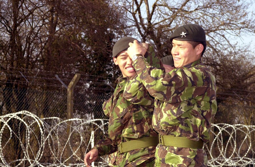 ROYAL AIR FORCE FAIRFORD, England -- Two riflemen from the 3rd Regiment of Gurkha Rifles, an elite unit within the British Army, practice martial arts tactics here March 20.  The legendary Nepali fighters of the 3rd RGR are here to safeguard the base, joining forces with Air Force security forces, Royal Air Force and Ministry of Defence police and local constabularies.  (U.S. Air Force photo by Airman 1st Class Stacia Willis)