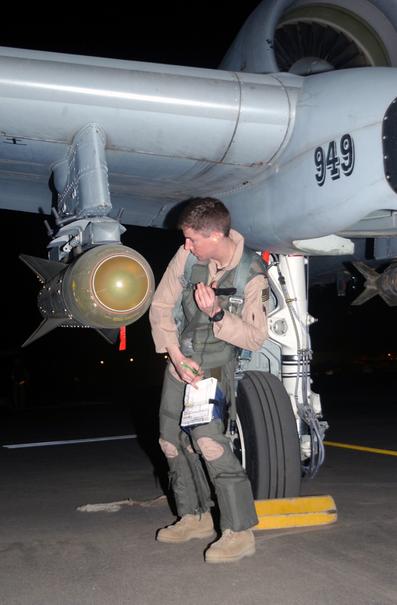 1990's -- OPERATION IRAQI FREEDOM -- 1st Lt. William "Animal" Cheal, with the Air National Guard's 172nd Fighter Squadron out of Battle Creek, Mich., goes through preflight checks on his A-10 Thunderbolt II at a desert air base in the Arabian Gulf Region as part of his alert standby tasking to provide close air support to advancing coalition ground troops. Operation Iraqi Freedom is the multinational coalition effort to liberate the Iraqi people, eliminate Iraq's weapons of mass destruction and end the regime of Saddam Hussein. (U.S. Air Force photo by Master Sgt. Stefan Alford)