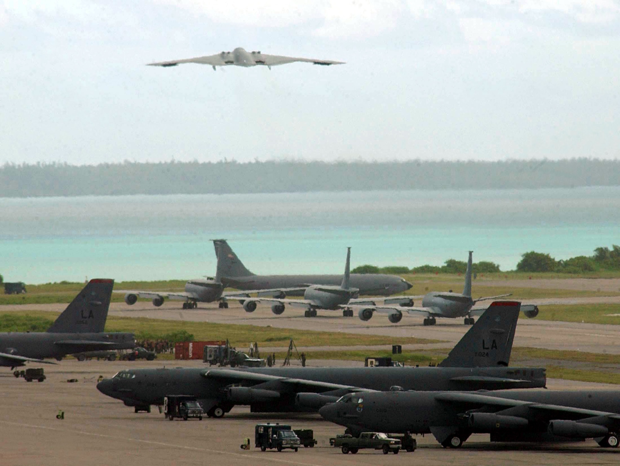 OPERATION ENDURING FREEDOM -- A B-2 Spirit takes off for an Operation Iraqi Freedom bombing mission while other aircraft from 40th Air Expeditionary Wing prepare to launch from a forward-deployed location. The B-2's "stealth" characteristics give it the ability to penetrate an enemy's most sophisticated defenses and threaten its most valued and heavily defended targets. (U.S. Air Force photo by Senior Airman Nathan G. Bevier)